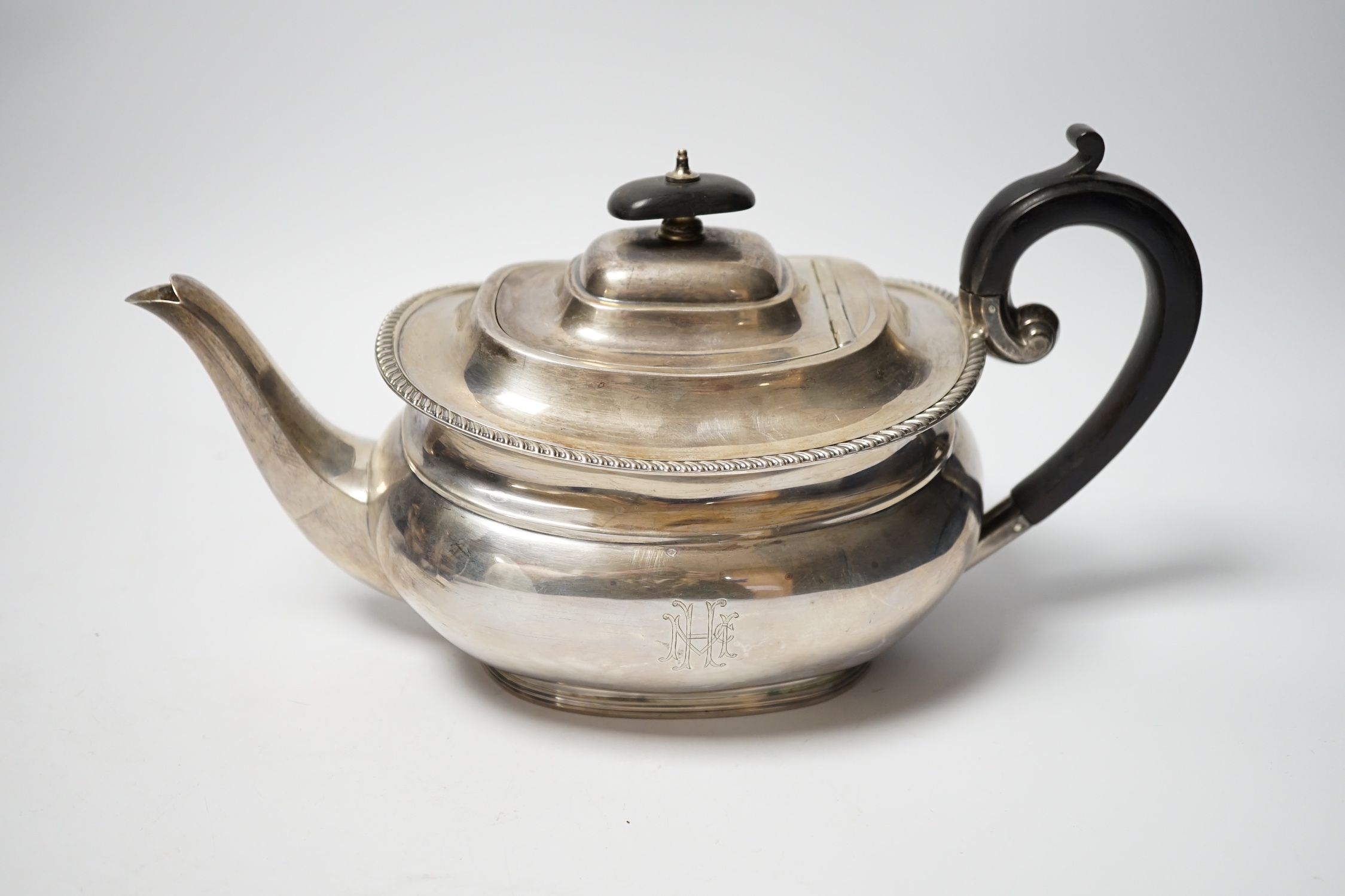 A George V silver teapot by Sebastian Garrard, London, 1927, gross weight 20.9oz.
